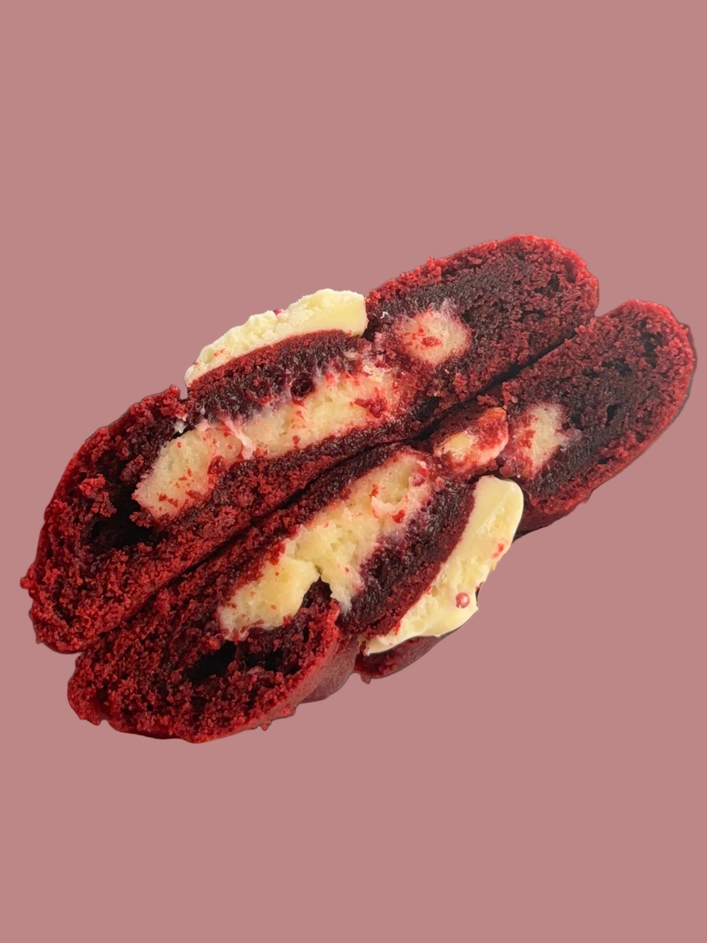 Red velvet cookie with creamy cheesecake filling from Bake With Mimi on pink background