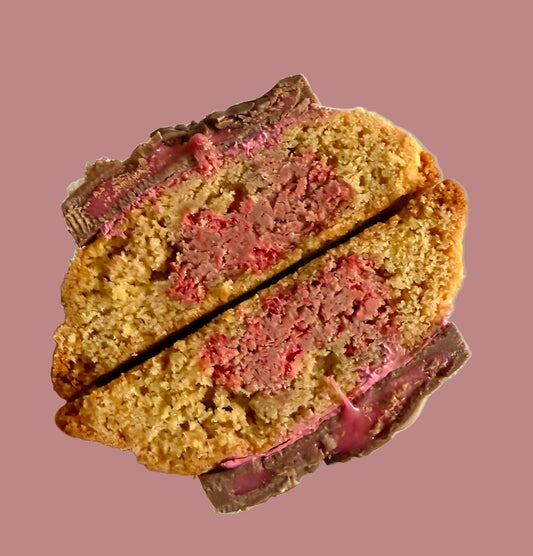 Cross-section of a homemade vanilla cake with pink frosting, Bake With Mimi style dessert